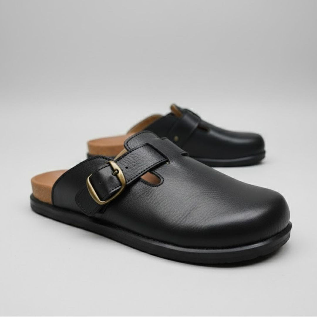 Black leather clogs with wooden sole on a light gray background