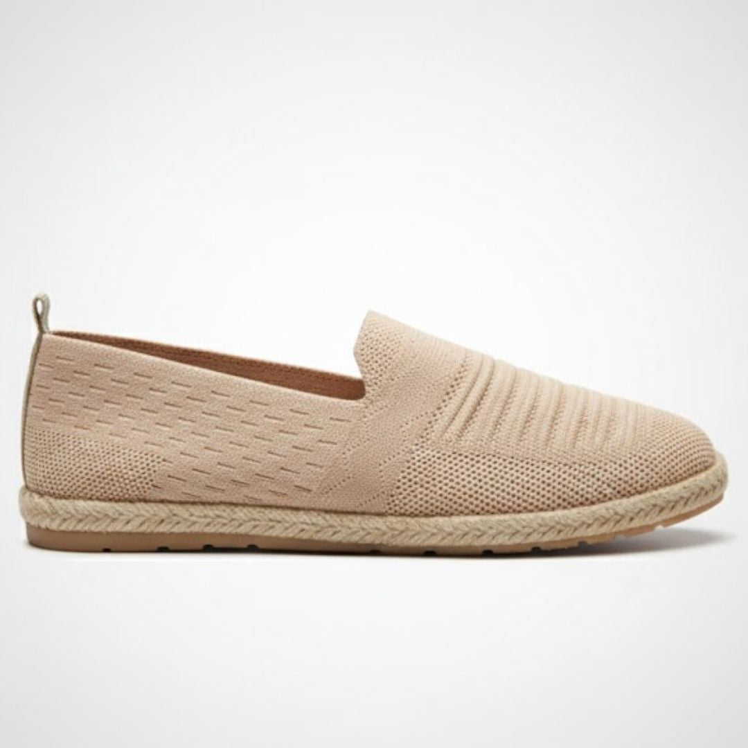 Beige loafer shoe on a light gray background