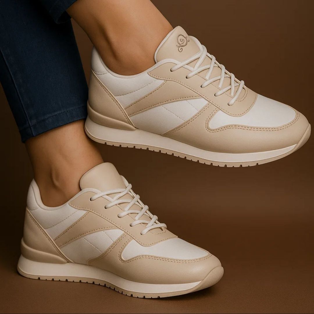 Beige and white sneakers on a brown background