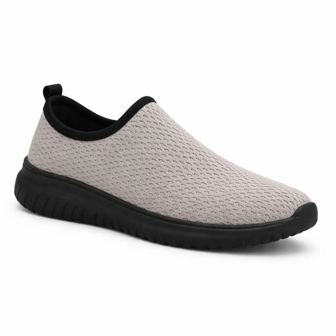 Gray slip-on shoe with black sole on a white background