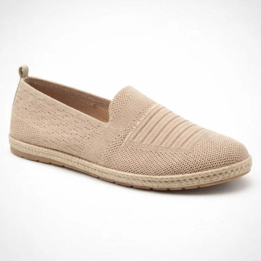 Beige espadrille shoe on a white background