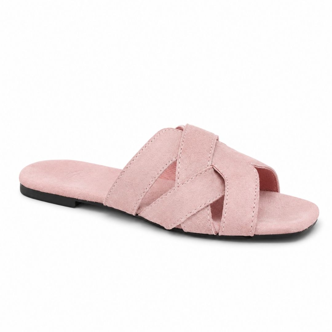 Pink sandal with criss-cross straps on a white background