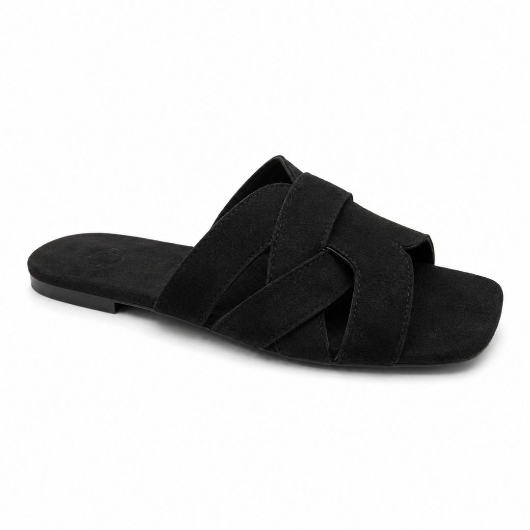 Black sandal with criss-cross straps on a white background