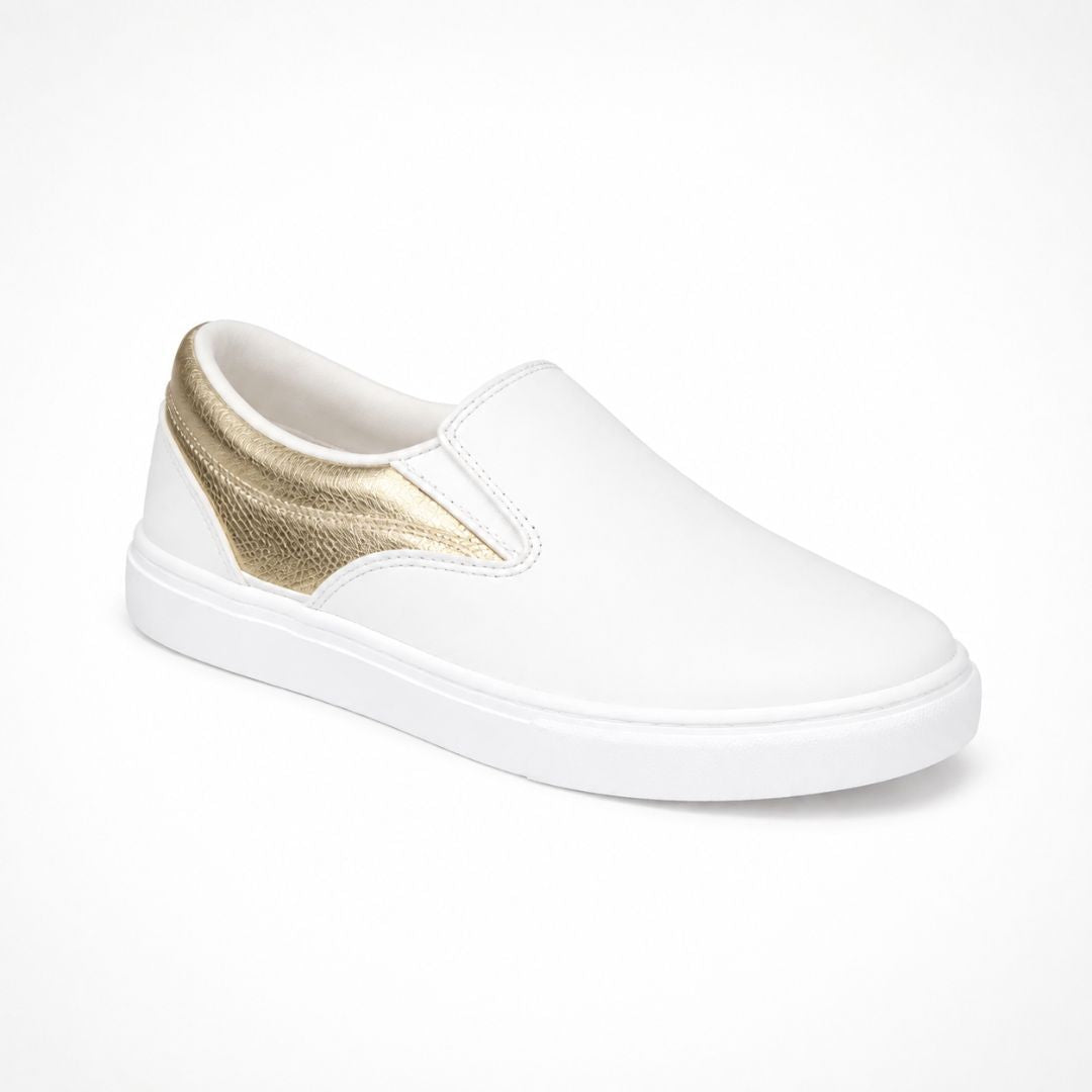 A white slip-on sneaker with a metallic gold accent panel on the heel, shown from a three-quarters angle on a white background.