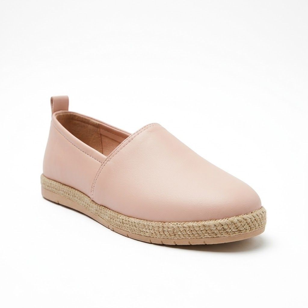 Pink espadrille shoe on a white background