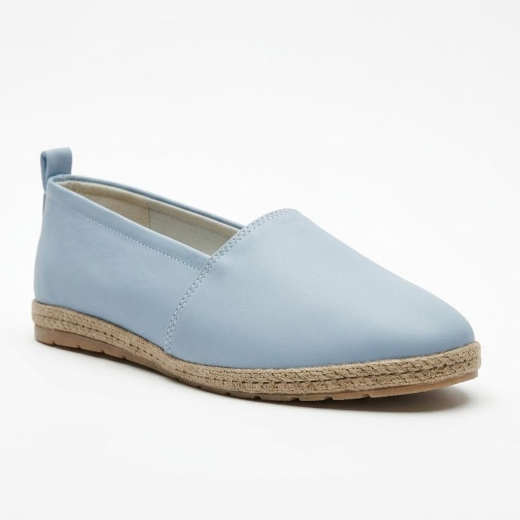 Light blue slip-on shoe with a textured sole on a white background