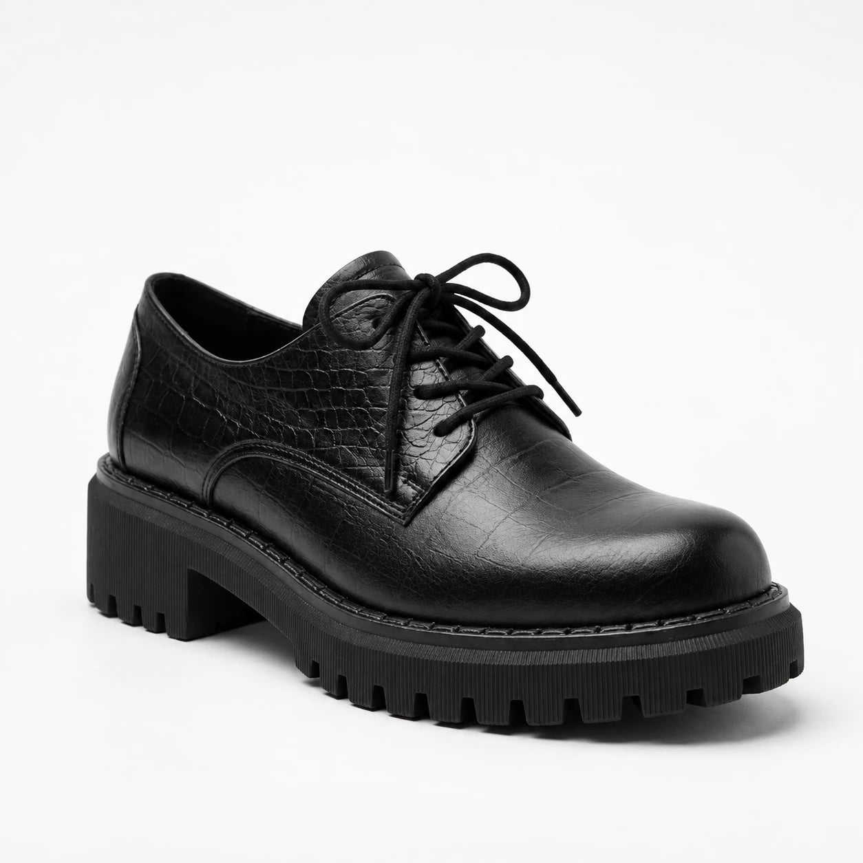 A single black leather lace-up oxford shoe with a textured crocodile-embossed upper, black laces, and a chunky lug sole, shown on a clean white background.