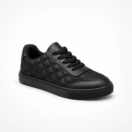 Black low-top quilted sneaker with shiny side panel, three-quarter view