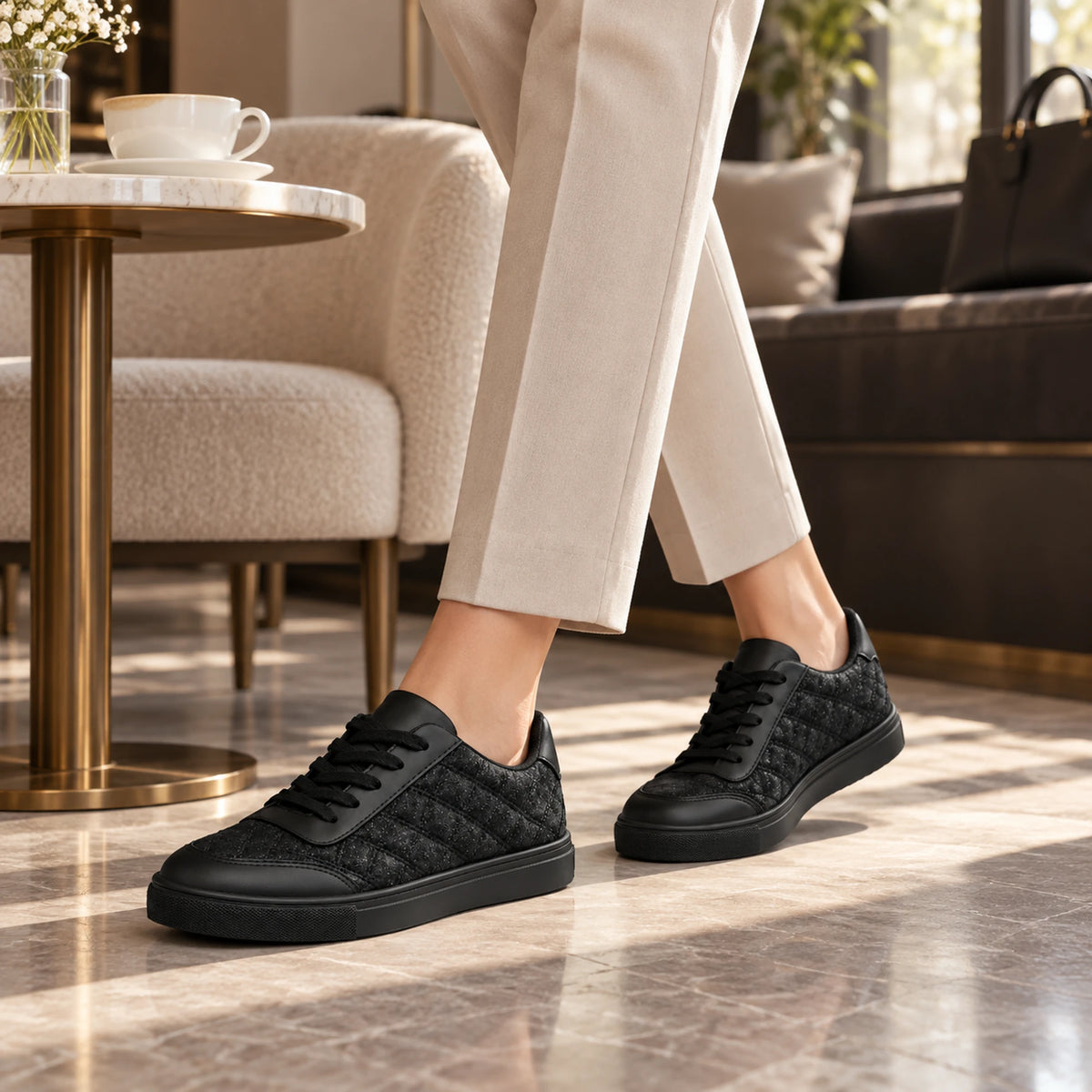 Black quilted sneaker lifestyle shot 1