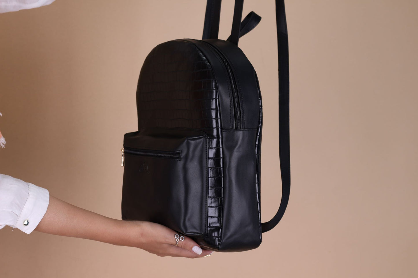 Black leather women's backpack, light and comfortable, with a suitable size and price from Shoppingooo
